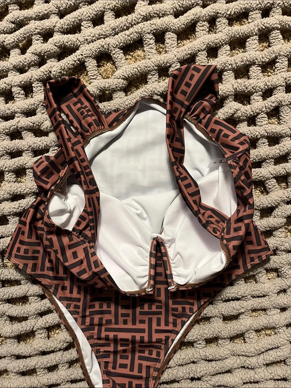 Pretty one piece swimsuit. Brown and black with sexy V cleavage and high hip cut